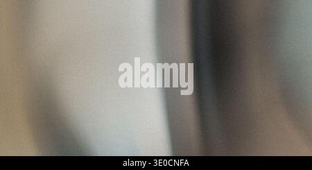 This image features a blurred background with vertical lines in muted beige, gray, and brown tones. The lack of focus creates a soft, abstract effect. Stock Photo