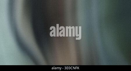 An image featuring a blurred abstract background with vertical streaks of teal, gray, and muted brown tones. The effect creates a soft, dreamy atmosph Stock Photo