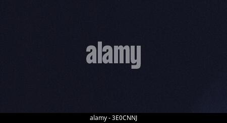 A simple image featuring a solid dark blue background. The color is uniform with minimal variation or texture. Stock Photo