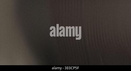 An out-of-focus image showing a dark brown and gray background with a slightly textured appearance. The colors are muted and blend seamlessly. Stock Photo