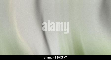 A softly blurred image featuring a subtle gradient transition from light grey to a pale, muted green. The effect is smooth and ethereal. Stock Photo