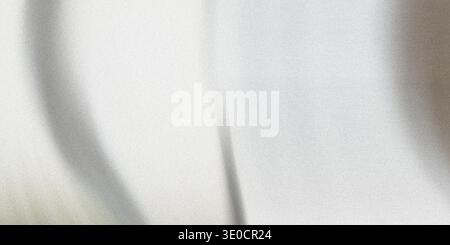 A detailed image showcasing the smooth texture of a white fabric. The image is softly lit, highlighting the subtle folds and drape of the material. Stock Photo