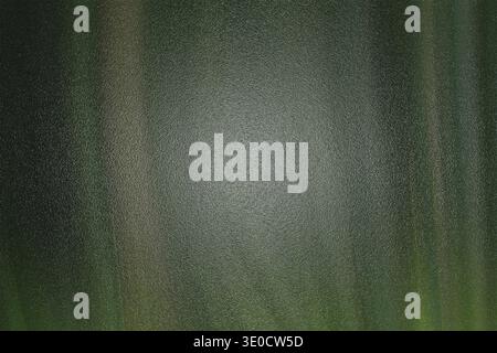 A digitally created abstract image featuring blurred vertical lines in shades of green and gray, creating a textured background effect with a lighter Stock Photo