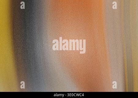 An image featuring a blurred abstract design with vertical stripes in shades of orange, yellow, gray, and black. The colors blend seamlessly, creating Stock Photo