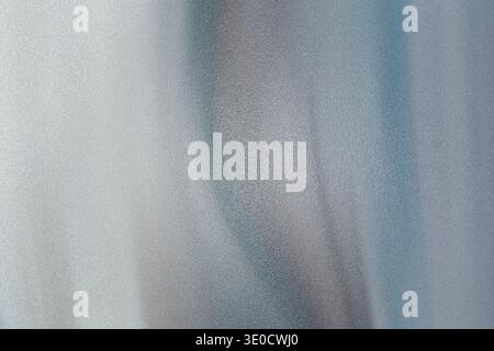 An image featuring an abstract background with vertical streaks of light gray and blue hues. The blurry effect creates a soft, ethereal atmosphere. Stock Photo