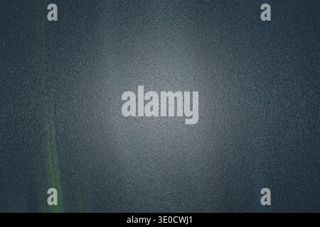 A digitally created abstract background image featuring a dark teal and green gradient with a lighter center, exhibiting a textured, slightly blurred Stock Photo