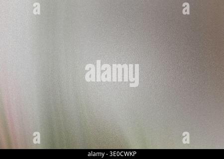 A softly blurred image featuring a subtle gradient of light gray and white tones. The texture is smooth with a slight vertical streak effect. The over Stock Photo