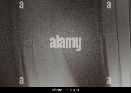 An image featuring an abstract texture with vertical lines blending shades of gray and white, creating a blurred, slightly hazy effect. Stock Photo