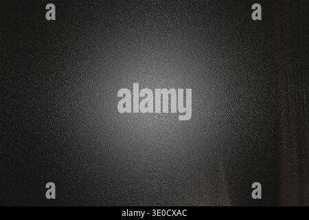 A dark gray background image features a subtle lighter center, creating a vignette effect. The texture is slightly rough, adding depth and visual inte Stock Photo