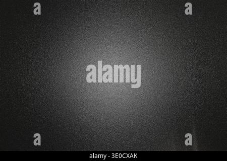 A subtly textured dark gray background image features a gradient effect, creating a vignette around the center. The texture is slightly grainy, provid Stock Photo
