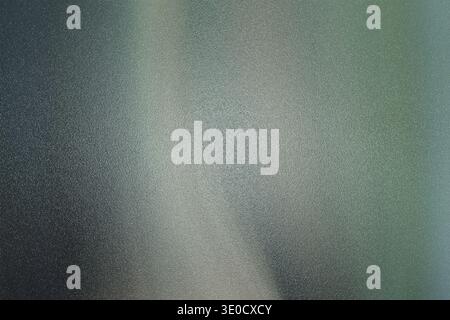 An abstract image featuring a blurred gradient transitioning from dark teal to light gray. The effect creates a soft, ethereal feel with subtle vertic Stock Photo