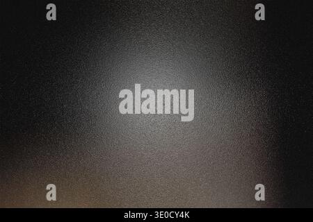 A high-resolution image featuring a dark grey textured background. A subtle light source illuminates the center, creating a gradient effect from dark Stock Photo