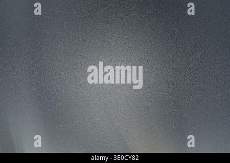 A high-resolution image featuring a dark gray background with a subtle gradient and a slightly textured appearance. It's ideal for use as a simple yet Stock Photo
