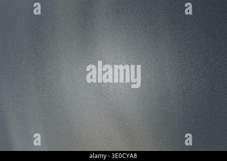 A high-resolution image showcasing a subtly textured gray background. The image features a gradient of shades, creating a smooth, almost ethereal effe Stock Photo