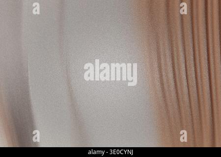 The image shows a blurred abstract background with a gradient transition from light beige to light brown. Vertical lines are subtly visible, creating Stock Photo
