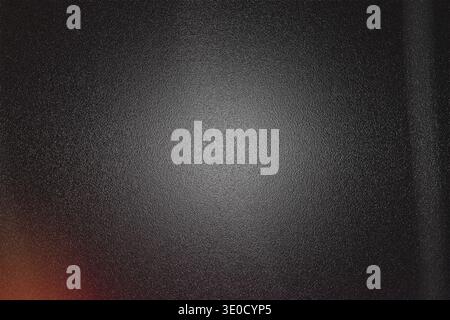 A dark gray background image features a textured surface with a subtle lighter center and a faint lens flare effect in the bottom left corner. The ove Stock Photo