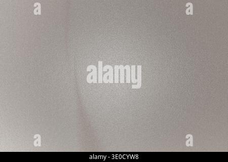 The image shows a blurred, out-of-focus close-up of a light-colored surface. The texture is subtle, and a faint vertical line is visible. The overall Stock Photo