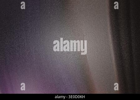A detailed image showcases the texture of a dark gray fabric. Vertical lines are subtly visible, suggesting a woven or possibly slightly creased mater Stock Photo