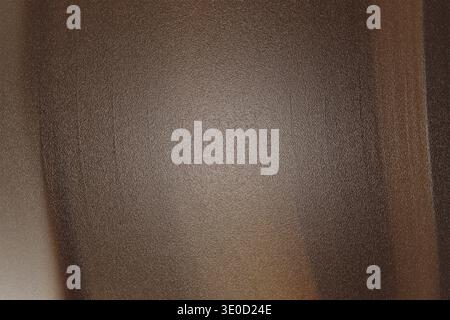 The image shows a detailed close-up of a dark brown wooden surface. The texture is slightly grainy and appears to be a flat, vertical plane. The light Stock Photo