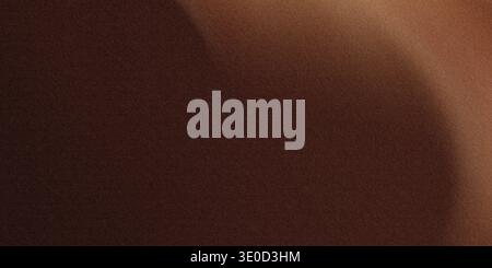 An out-of-focus image showing a gradient of brown and beige tones. The texture is smooth with subtle variations in shade. Stock Photo