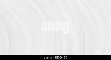 A close-up image showcasing the texture of a smooth, white fabric with subtle wrinkles and creases. The background is a consistent off-white color. Stock Photo