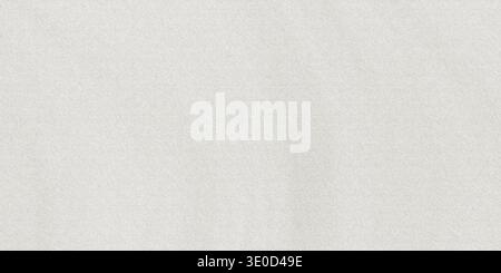 A detailed image showcasing the subtle texture of a plain white fabric. The image is primarily off-white with minimal visual details. Stock Photo