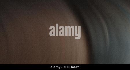 A blurry image featuring a blend of brown and gray tones creating an abstract, out-of-focus effect. The colors are muted and blend seamlessly. Stock Photo