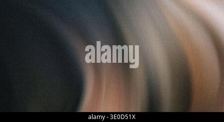 An abstract image featuring a blurred blend of dark and light brown tones, resembling flowing hair or fabric. Stock Photo