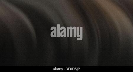 A blurry image featuring dark, swirling textures creating an abstract background. The colors are predominantly dark grays and browns. Stock Photo