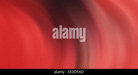 A blurred image featuring a vertical gradient transitioning from dark hues to vibrant red. The effect is smooth and abstract. Stock Photo