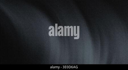A blurry image featuring dark gray and black tones creating an abstract, textured effect. The image lacks sharp focus and details. Stock Photo