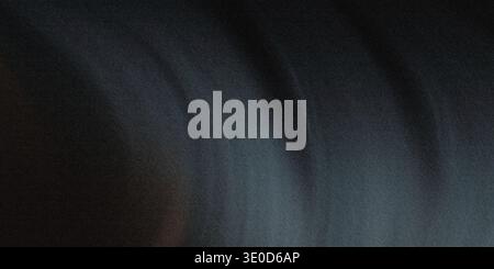 An out-of-focus image showing dark, textured material. The texture suggests it could be hair or a dark fabric. Stock Photo