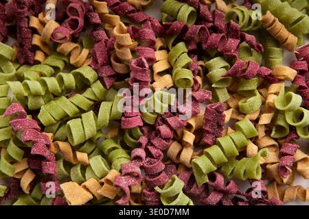 Mixture of colorful fusilli isolated on white Stock Photo