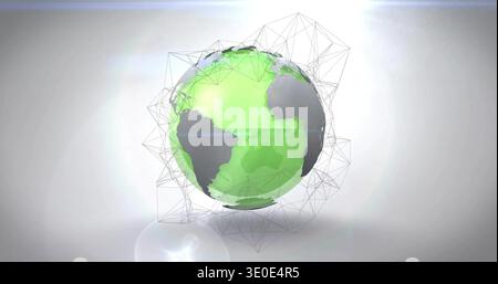 Hovering stylized globe displaying green continents in studio, with wireframe and lens flare Stock Photo
