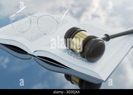 wooden judge's gavel and round glasses rest on an open law book, reflecting on a glossy surface against a blue sky with clouds. Concept of legal educa Stock Photo