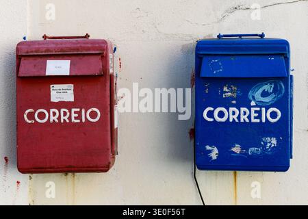 A pair of colorful mailboxes in Lisbon, Portugal for local and international post with the word "correio" which translates to "mail"in Portuguese. Stock Photo