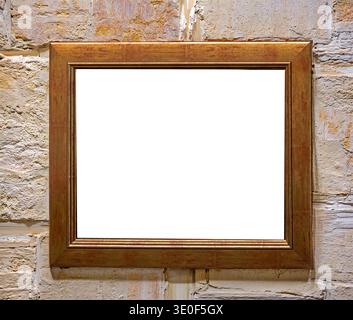 Old empty wooden frame hanging on grunge stone wall interior Stock Photo