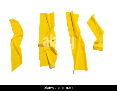 Set of yellow adhesive tape strips with wrinkles, folds, and glossy surface texture. Abstract sticky tape elements in sunlight with shadows for collag Stock Photo