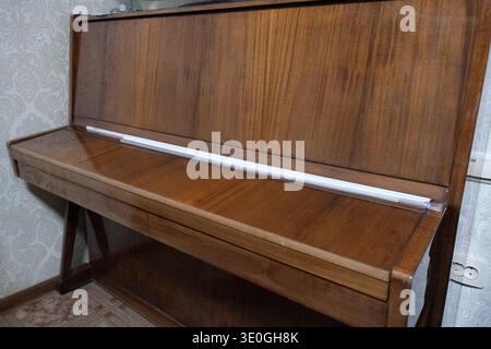 Vintage upright piano isolated on white background, front view Stock Photo