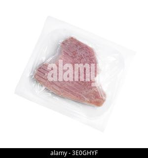 a slice of frozen tuna in a plastic bag on a transparent surface Stock Photo