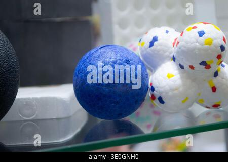 Balls dog toy. Durable foam dog ball close-up. Shape of connected balls, multi-colored pattern. Object made of material expanded polypropylene EPP, universal foam. New modern industrial technologies. Stock Photo