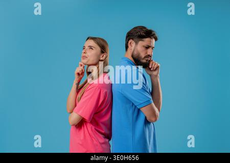 Young Pretty Woman Gazes Dreamily, Bearded Male Partner Looks Thoughtful,Focused Stock Photo