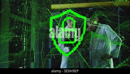 Two technicians wearing white coats studying green shield hologram over glass with server racks. Cybersecurity, data, visualization, matrix, projectio Stock Photo