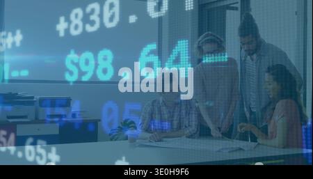 Reviewing four coworkers examining plans in meeting room in casual shirts, with finance overlay. Colleagues, team, office, boardroom, documents, diagr Stock Photo
