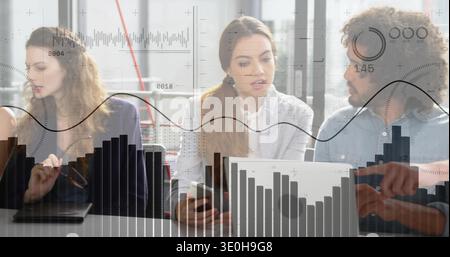 Discussing team gesturing, listening at table in biz casual, with laptop or phone or glasses or overlays. Office, conference, collaboration, brainstor Stock Photo