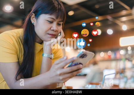 Social media engagement with like and heart icons. Digital marketing and online customer feedback concept. Influencer interacting with followers on sm Stock Photo