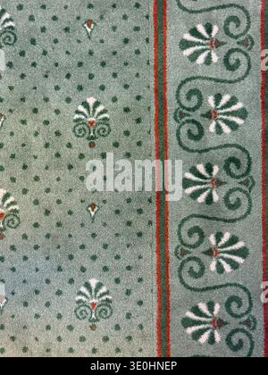 Carpet pattern with red and green intricate design as seamless ornamental background. Mobile photo Stock Photo
