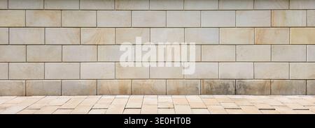 Beige Stone Brick Wall Texture with Sidewalk, Neutral Architectural Background, Natural Masonry Facade Pattern for Urban Design, Construction and Exte Stock Photo