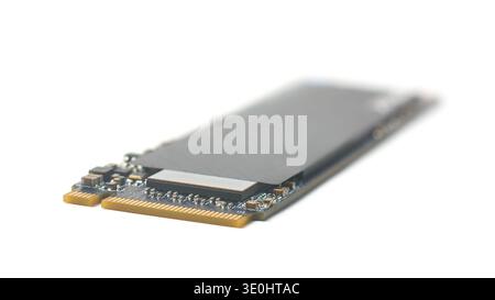 m.2 solid state drive isolated white background, gold connector pins and black chassis, soft focus of technology and fast data transfer speed concept Stock Photo