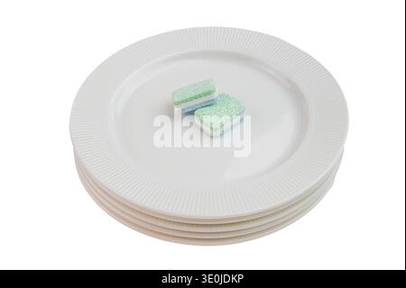 Solid cleaning tablets for automatic dishwasher on white background highlighting texture layers and home hygiene routine. Stock Photo